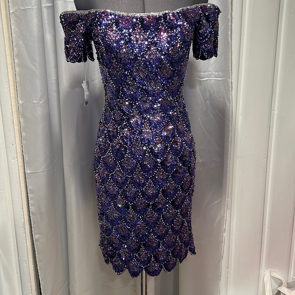 Purple sequins off the shoulder dress. Zipper up the back. Never worn.